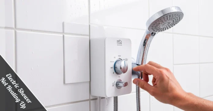 Electric shower not heating up problem - hand adjusting temperature dial on chrome shower unit mounted on tile wall.